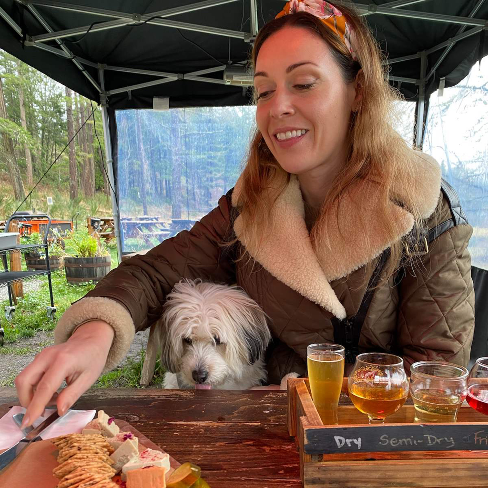 Marie and her dog at a restaurant